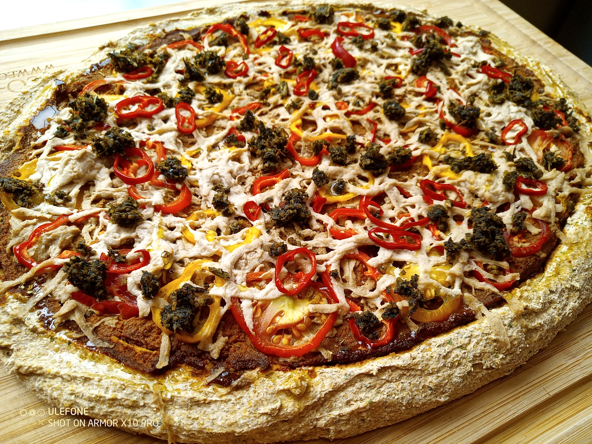 Raw pizza with taco meat